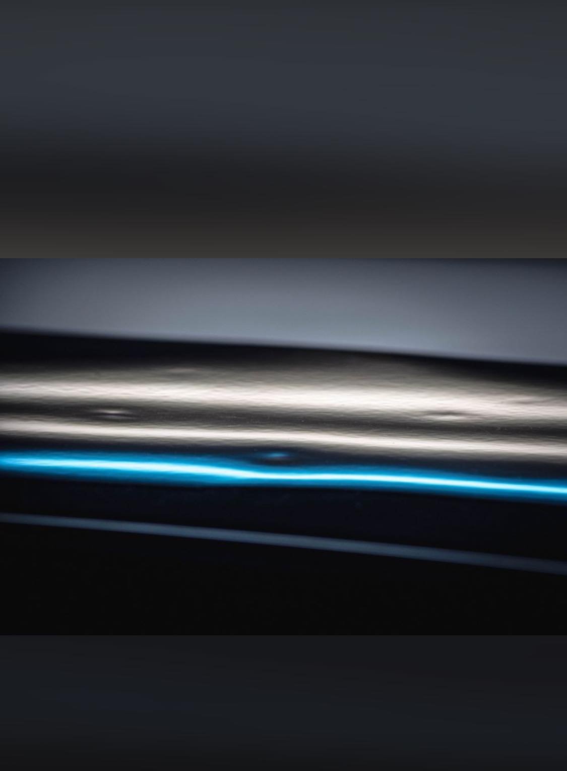 Paintless dent repair light showing hail dents